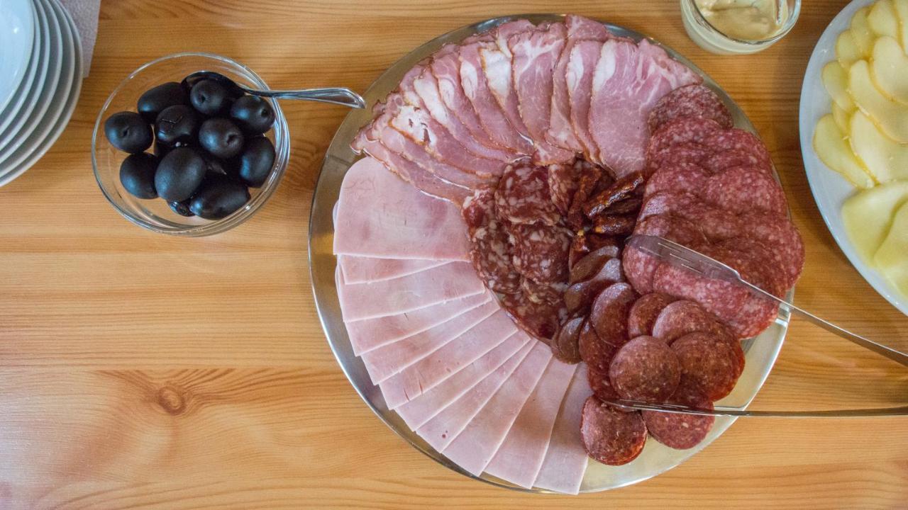 Noblesse Boutique Resort Sibiu Exterior photo A selection of cured meats